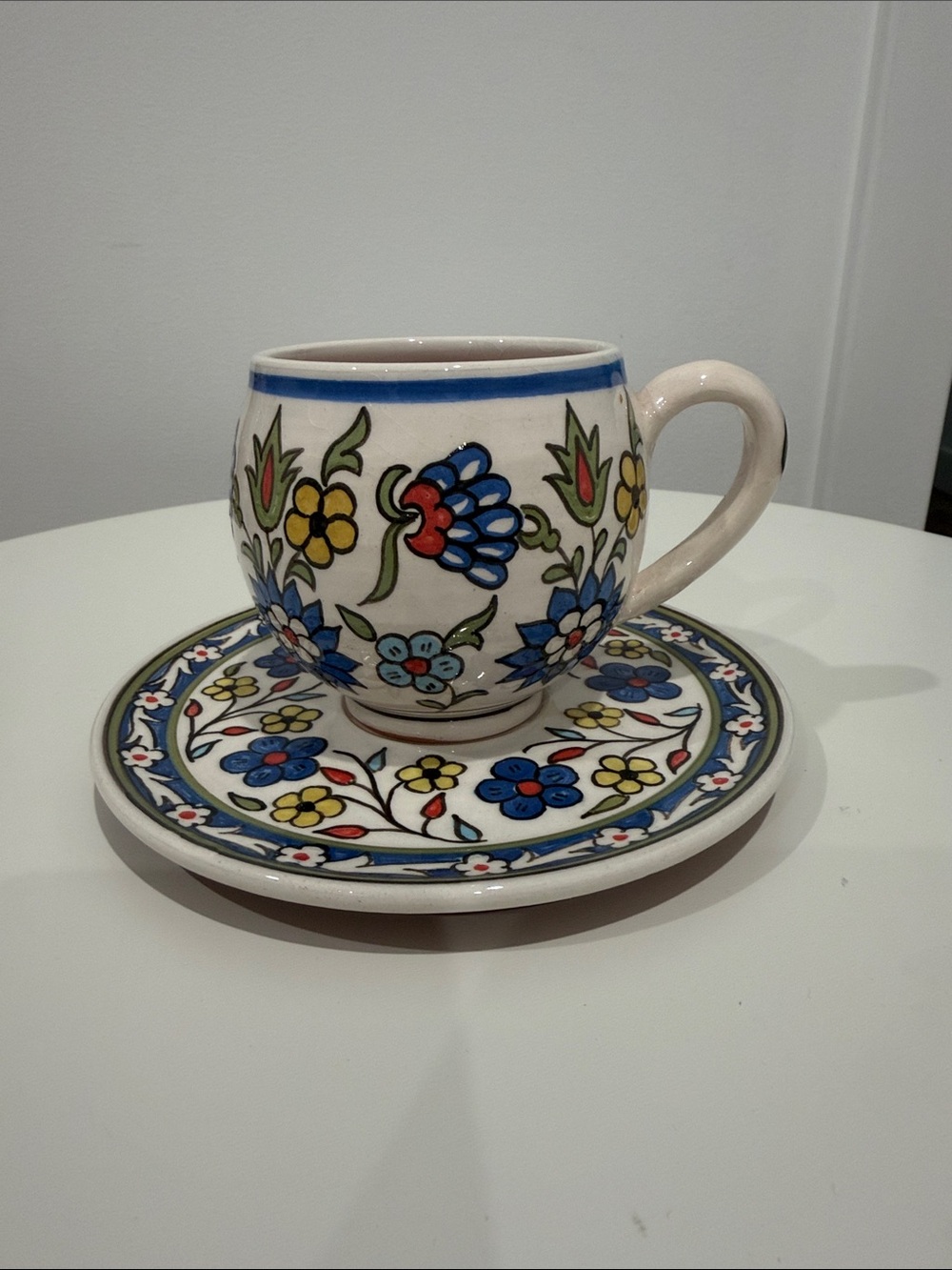 Hand-Painted Floral Ceramic Cup and Saucer – Blue, Yellow, Red